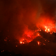 Flames flare up from a wildfire near Placenta Canyon Road in Santa Clarita on Sunday (Image: Associated Press)